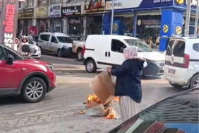 Siirt’in Kurtalan ilçesinde bir kadın Suriye geçici hükümetinin Kürtlere yönelik saldırılarını protesto etmek amacıyla sokak ortasında ateş yaktı
